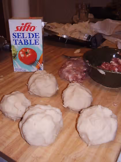Acadian cuisine — Poutines râpées , traditional Acadian dish.