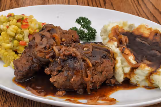 Salisbury steak — Two salisbury steaks with brown sauce