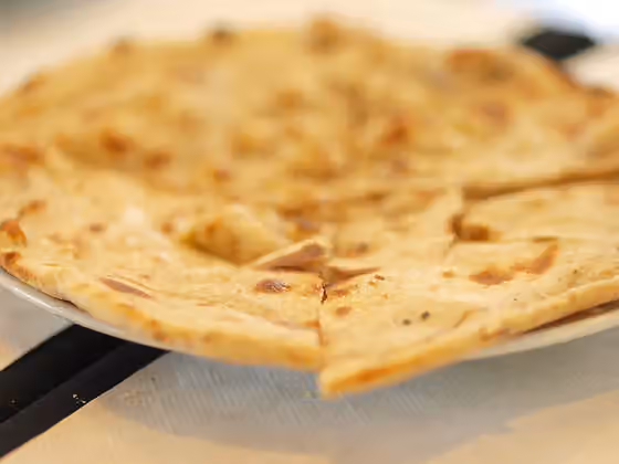 Mozambican cuisine — Apa, a goese bread photographed in Lisbon, Portugal.