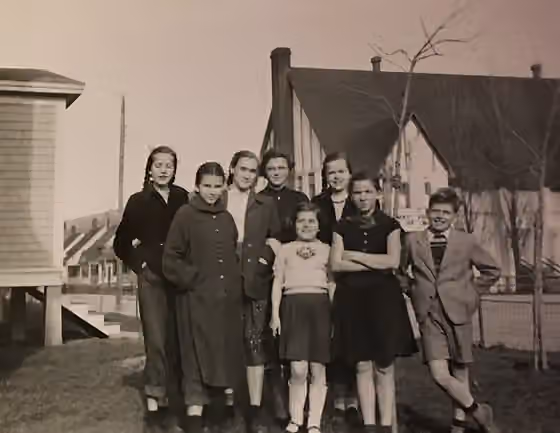 Latvian Canadians — Baltic children in the front garden at 11 East Valley Road with the Majestic Theatre in the background.