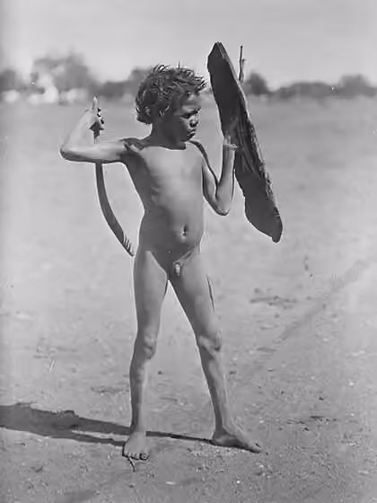 Arrernte people — Arrernte boy holding toy shield, Alberga River, South Australia 1920–24