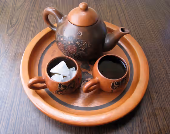 Teh poci — Teh poci gula batu is Indonesian Javanese black tea served in earthenware tea set with rock sugar.