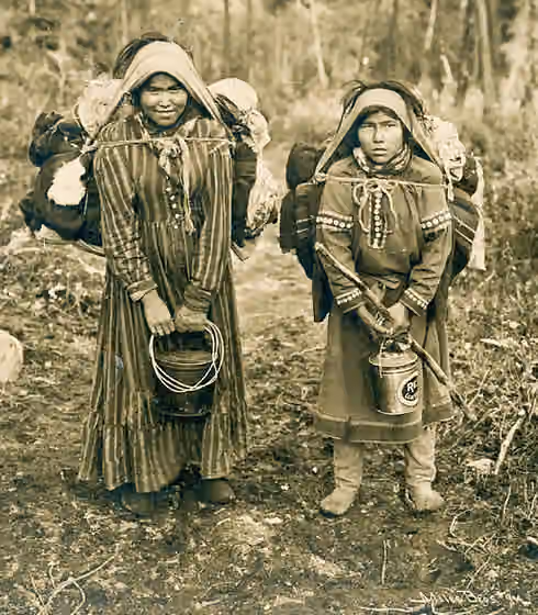 Ahtna — Chief Stickwan's two daughters holding buckets and carrying burdens on backs with trumplines