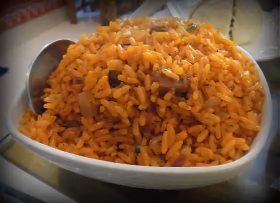 Meghalayan cuisine — Red rice with mutton pieces.