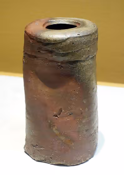 Bizen ware — Flower vase in shape of travel pillow Artist: Bizen ware Period/Century: Edo period, 17th century Material: Stoneware with natural ash glaze Donor: Gift of Mr.