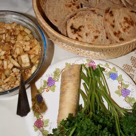 Karpas — Some foods prepared for a Passover Seder: (clockwise from top) unleavened bread, parsley, horseradish, charoset