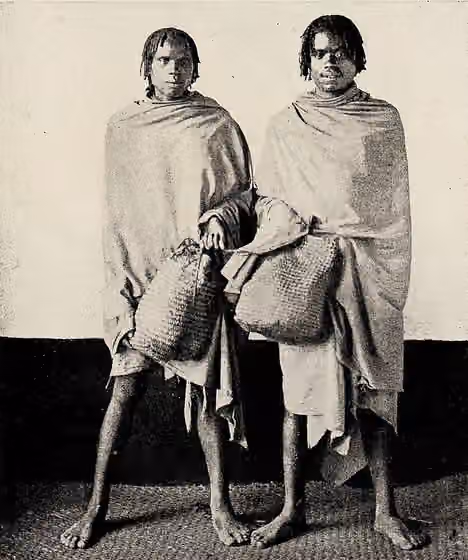 Sihanaka — Sihanaka men with meat baskets wearing lamba, taken from James Sibree's "A naturalist in Madagascar" (1915)