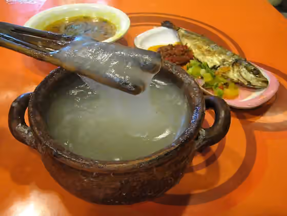 Papeda — Papeda (sago congee), Kuah Kuning (yelow soup) and Ikan Tude Bakar (grilled fish) with Dabu-dabu and Rica sambal.